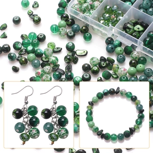Detail of green glass beads DIY kit with storage box and handmade jewelry examples