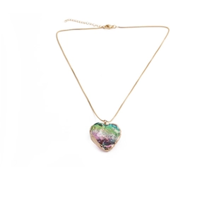 Detail of colorful heart crystal pendant with gold plating on a fine metal chain necklace