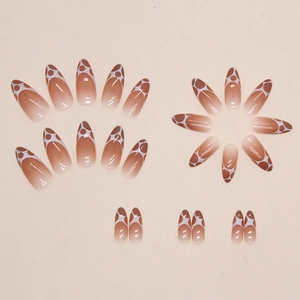 Brown gradient almond press-on nails with white bubble polka dot patterns
