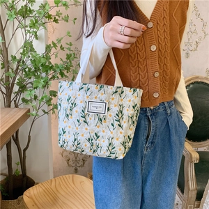 Sac à main en toile brodé de marguerites pour collations et déjeuner avec étiquette
