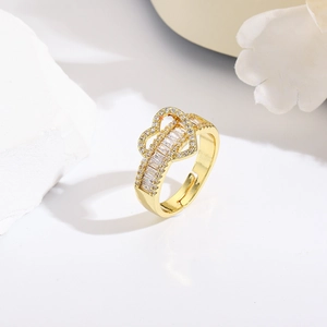 Macro shot of 18k gold plated open heart ring with sparkling pave zircon settings