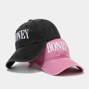 Vintage washed cotton baseball caps with HONEY embroidery in charcoal and dusty pink