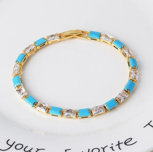Luxury gold chain bracelet featuring turquoise stones and micro-pave cubic zirconia accents