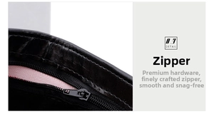 Close-up of smooth metal zipper and pink lining on men's leather wallet detail