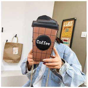 Macro view of coffee cup shaped crossbody bag with brown plaid PU leather and gold chain