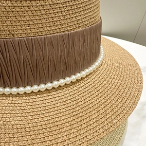 French style flat top straw hat with brown ribbon and pearl accents for summer sun protection