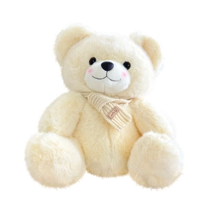 Cute cream plush teddy bear with a knitted scarf shown on a clean white background