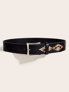 Macro shot of punk style black leather belt with leopard print inlays and silver studs