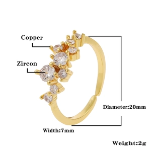 Detailed view of adjustable golden crown ring with cubic zirconia micro-pave setting
