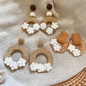 Bohemian rattan earring set with wood pieces and small fabric flowers for beach vacations