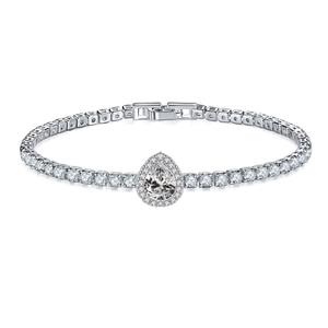 Macro detail of silver tennis bracelet featuring pear-shaped central stone and round zircons
