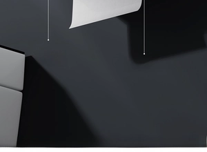 Detail view of wall-mounted tissue box featuring dual outlets for rolls and paper