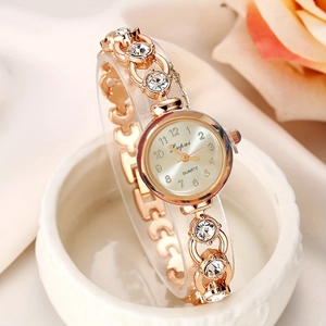Elegant rose gold quartz watch for women featuring crystal inlaid alloy bracelet and white dial