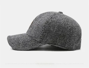Side view of winter baseball cap with ear protection showing texture and leather patch