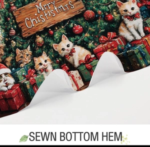 Detail showing the sewn bottom hem of a Christmas shower curtain with cute cat print