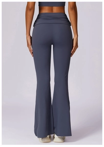 Detail showing high waisted flared yoga pants with ruched waistband and lifting effect