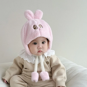 Cute pink plush baby bunny ear hat with embroidery and pompom ties for winter warmth