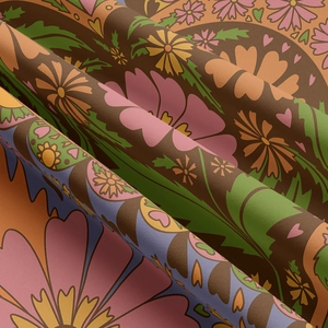 Macro detail of textured floral tapestry fabric with vintage heart pattern and soft folds