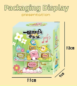Detaillierte Verpackung der Doraemon-Spieluhr in frischen Grün- und Hellblautönen