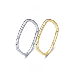 Macro detail of S925 sterling silver square rings with zircon inlay in gold and silver