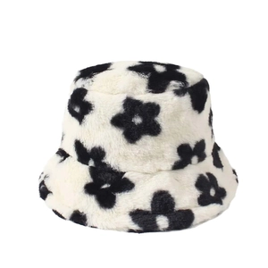 Unisex plush bucket hat with black floral pattern on white faux rabbit fur fabric