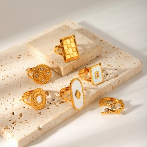 Detailed set of 18k gold plated geometric rings with white shell inlay and rhinestones