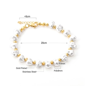 Macro detail of 18K gold plated stainless steel bracelet with white pearls and beads