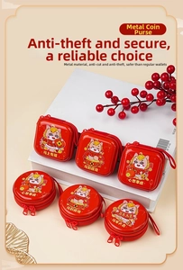 Detail view of festive red tinplate coin purses with New Year horse zodiac patterns