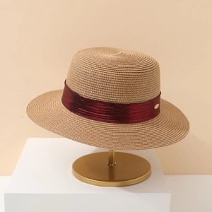 French minimalist flat top straw hat with deep red metallic ribbon and gold buckle
