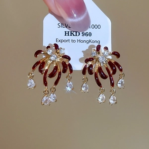 Detail of fireworks stud earrings with burgundy enamel and silver 1000 hallmark