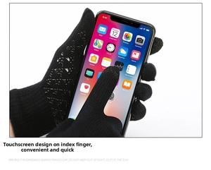 Detail of black knitted gloves featuring conductive touchscreen tips on index fingers