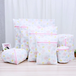 Detailed set of mesh laundry bags with colorful animal prints and pink zippers