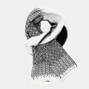 Detail of soft knit scarf with classic black and white bird's eye geometric pattern
