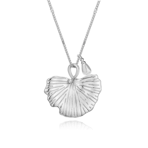 Detailed view of silver ginkgo leaf necklace featuring a delicate white pearl pendant