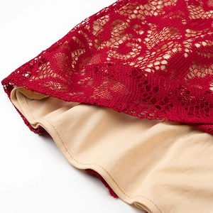 Detail of red floral lace overlay with beige lining on a slim-fit evening maxi dress