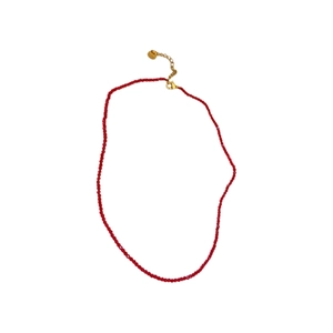Minimalist red crystal beaded necklace with golden adjustable chain on white background