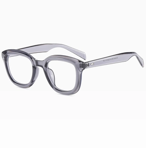Detail of grey transparent square frame glasses showing model specs on the temple