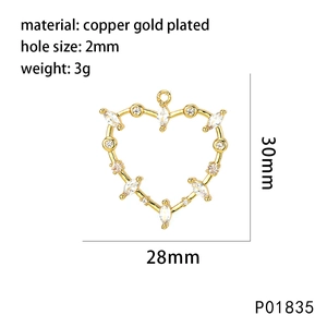 Detail showing 28mm gold plated heart cross charm with micro paved zircon stones