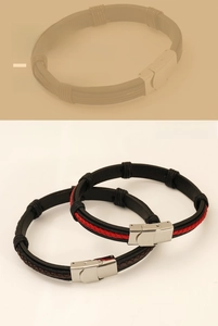 Close-up of braided leather bracelets with metallic magnetic clasps in red and black