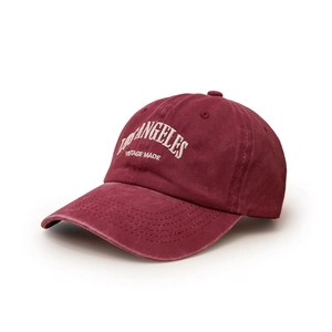Detail of vintage washed cotton baseball cap in burgundy with white LOS ANGELES embroidery
