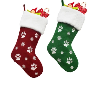 Christmas stockings with paw print embroidery and snowflakes in red and green colors