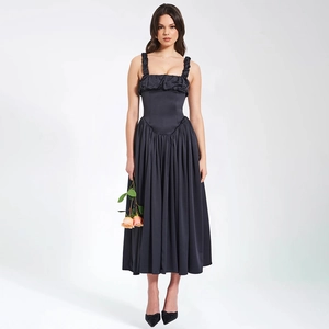 Detailed view of dark grey backless maxi dress with thin straps and pleated hem details