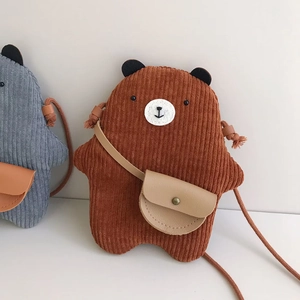 Detail showing brown corduroy texture and cute bear shape of children's crossbody bag