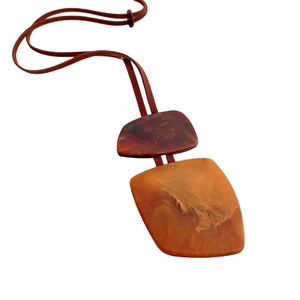 Vintage irregular amber and reddish-brown resin pendant necklace with dark brown cord