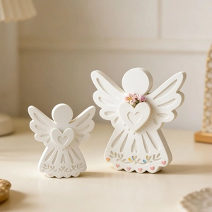 White wooden angel figurines set with heart relief and floral decor for home display