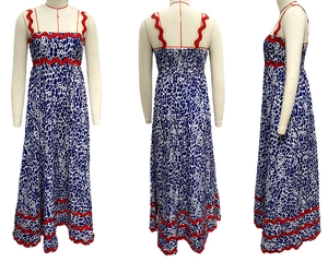 Detail view of the scalloped red trim and leopard print on a blue summer maxi dress