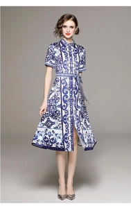 Detailed blue and white floral pattern on a summer A-line dress with buttons and belt