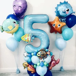 Ocean theme 5th birthday party decoration with giant blue number 5 and octopus balloon