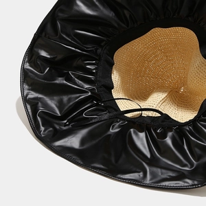 Women's summer straw sun hat with black UV lining and adjustable inner drawstring