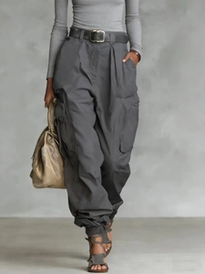 High-waist loose cargo pants in dark grey with multiple pockets and matching belt